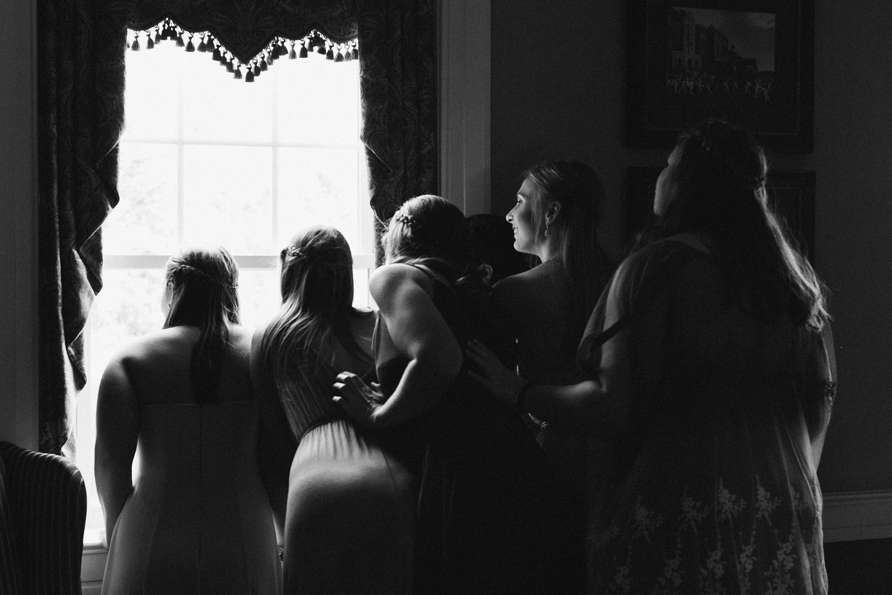 Bridesmaids sneaking a peek by Elle Danielle Photography